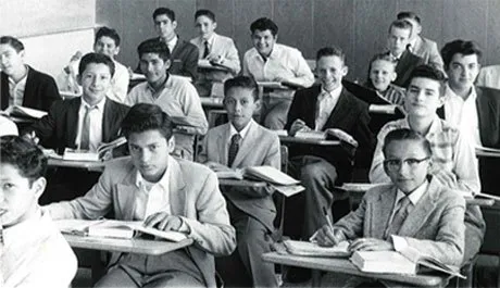 Boys at their desks in a 1950s Holy Cross classroom