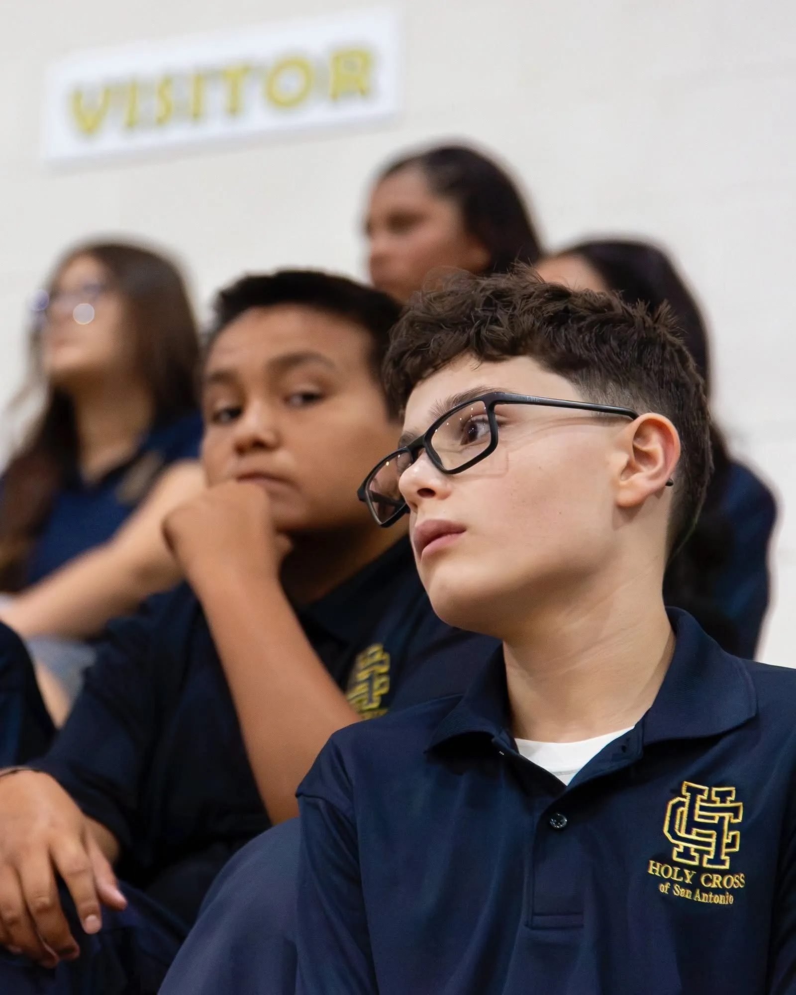 Holy Cross high-school students listening closely in class